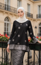 Woman wearing a Kurung Kedah Black Silver displaying overall styling and drape outfit in an outdoor setting.