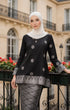 Woman wearing a Kurung Kedah Black Silver displaying overall styling and drape outfit in an outdoor setting.