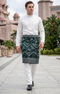Man wearing a traditional outfit Sampin Instant Kasturi Emerald Silverin an outdoor setting.