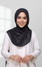 Woman wearing a Semi Instant Shawl HIjab Black Front view highlighting flowy edge and generous width and white blouse against a light gray background