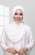 Woman wearing a Semi Instant Shawl 1 Muka Pearl White front drape view showing full length and soft chiffon fall and white top against a light gray background