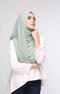 Woman wearing a Dusty Green shawl Hijab front drape view showing full length and chiffon texture and white blouse against a plain background