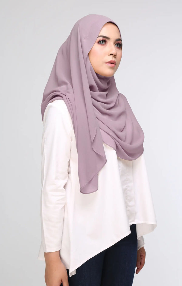 Woman wearing a Superfast 3.0 Smokey Purple shawl front drape view showing full length and soft chiffon and plain white shirt on a gray background