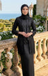 Woman in modern kebaya Kutu Baru Black with Instant Shawl hijab standing on a balcony with scenic background