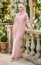 Woman wearing modern kebaya Kutu Baru Rose Gold front view showing V‑neck collar and French lace detailing