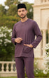 Baju Melayu Teluk Belanga Dusty Magenta front view full Traditional outfit with a black cap in an outdoor setting.