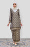 Woman wearing a Kurung Moden Black Gold Orchid showing brocade woven design and regular fit and instant shawl hijab on a white background