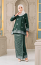 Model wearing Aryana Kurung Kedah Dark Emerald Green Silver displaying overall styling and drape