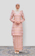 Woman wearing a traditional Kurung Moden Baby Pink Gold showing brocade woven design outfit with a Instant shawl plain on a white background