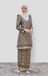 Model wearing Kurung Moden Black Gold Orchid displaying overall styling and drape