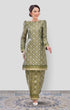 Woman wearing Kurung Moden Emerald Green Gold displaying overall styling and drape