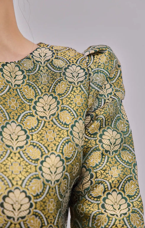 Fabric close up Kurung Moden Emerald Green Gold showing dyed brocade texture and gold highlights