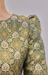 Fabric close up Kurung Moden Emerald Green Gold showing dyed brocade texture and gold highlights