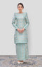 Woman wearing a Traditional Kurung Moden Mint Green Gold showing brocade woven design and regular fit with a patterned design on a white background