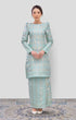 Woman wearing a Traditional Kurung Moden Mint Green Gold showing brocade woven design and regular fit with a patterned design on a white background