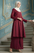 Kebarung Klasik Plain Maroon angled side view standing on a staircase with a decorative blue wall in the background