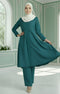 Kebarung Klasik Teal Green front view model wearing V neck labuh design in a decorated room.
