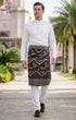 Man wearing a traditional outfit Sampin Instant Kasturi Tenun Brown Silver with a white shirt and in an outdoor setting.