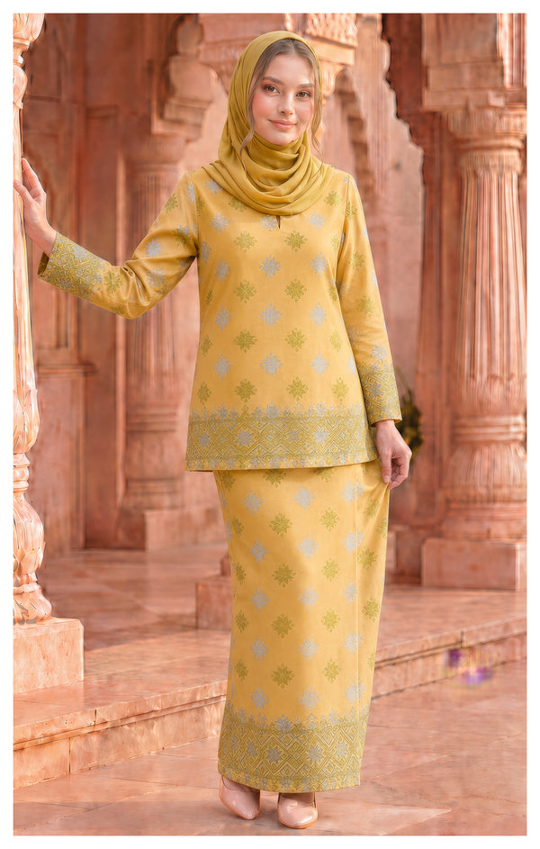 woman wearing Kurung Kedah Yellow front view songket round neck design