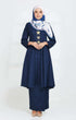 A woman wearing a Kebarung Klasik Navy Blue labuh design and cotton plain fabric, featuring a V-neck, long straight sleeves, and a back zip.