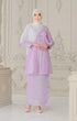 Woman wearing a Kebaya Lilac Purple Silver showing premium songket traditional outfit with a Instant Shawl white hijab in an ornate room.