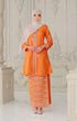 Woman wearing a Kebaya Orange Silver showing songket floral pattern and fit traditional outfit with a pearl white shawl hijab in a decorative room.