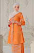 Model wearing Kebaya Orange Silver displaying traditional styling and drape