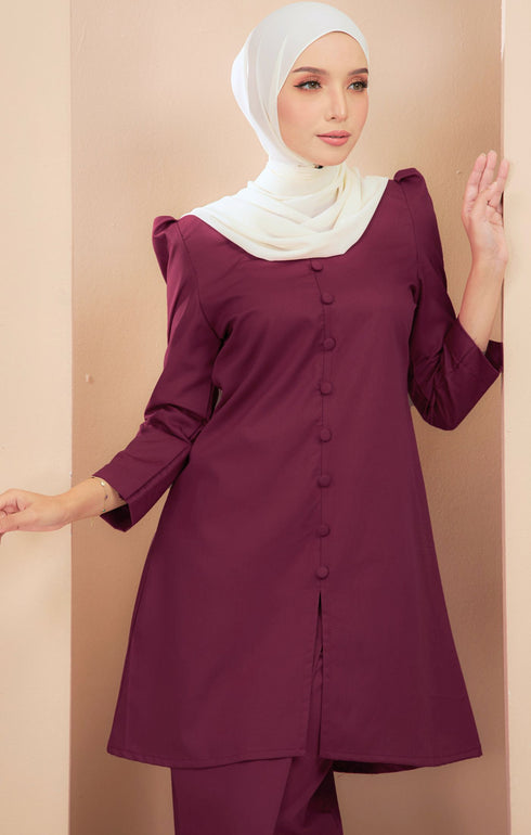 Kurung Riau Plain Magenta front view on model showing front button cut and shoulder puff
