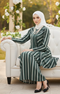 Model wearing Liyana 2.0 Kebarung Linen Emerald Green Stripe displaying overall styling