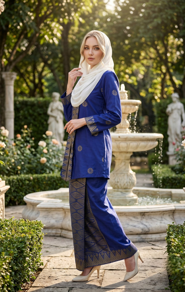 woman wearing Kebaya Kurung Moden Songket Dark Royal Blue Gold posing outdoors in full outfit