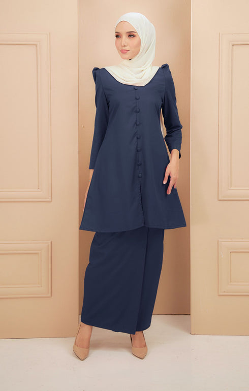 Kurung Riau Plain Navy Blue side view on model highlighting slim‑fit silhouette