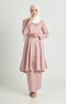 Woman wearing a traditional Kebarung Klasik Rose Gold showing klasik labuh design outfit with a peral white hijab on a white background
