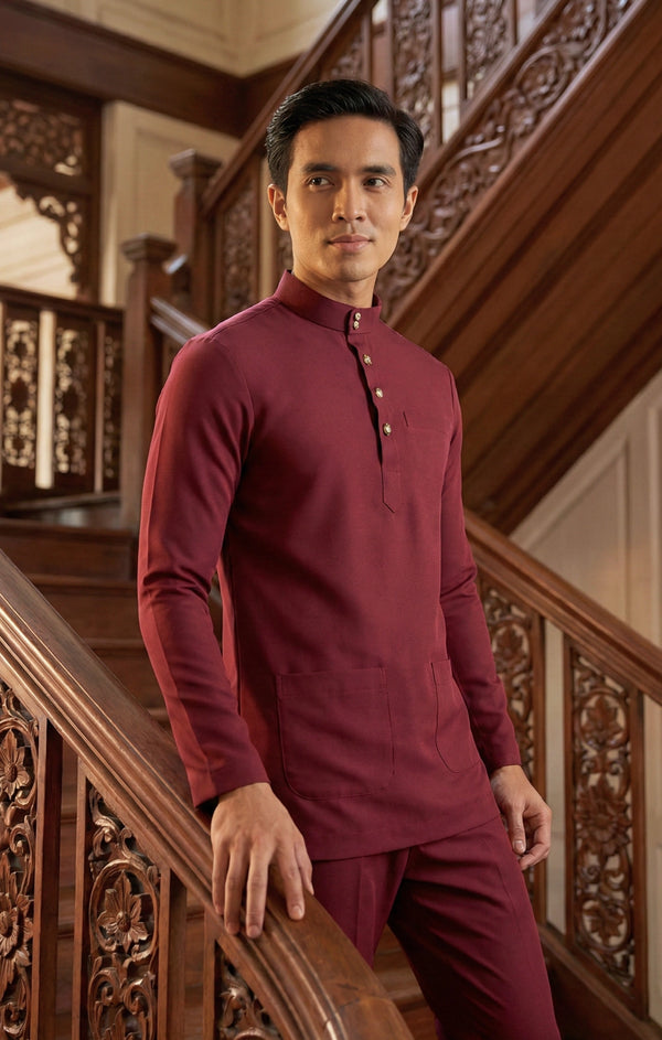 Side view of Naufal Baju Melayu Cekak Musang Maroon highlighting silhouette and pocket
