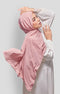 Woman wearing a Rose Gold Royal Satin Shawl Plain Hijab side view highlighting flowy edge and generous width white outfit against a gray background