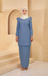 A woman wearing Kurung Moden Plain Dusty Blue front view on model showing round neck and puff shoulder