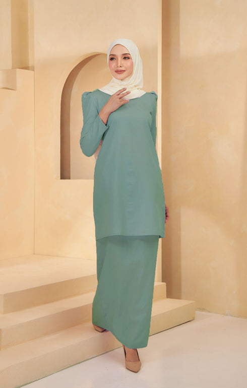 Kurung Moden Plain Dusty Green styling shot showing long straight sleeves on model