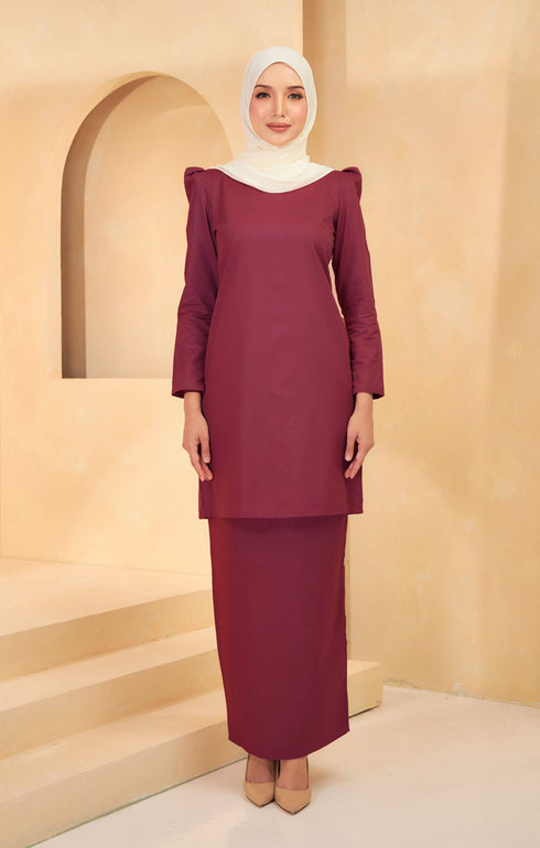 Kurung Moden Plain Maroon front view on model showing round neck and puff shoulder