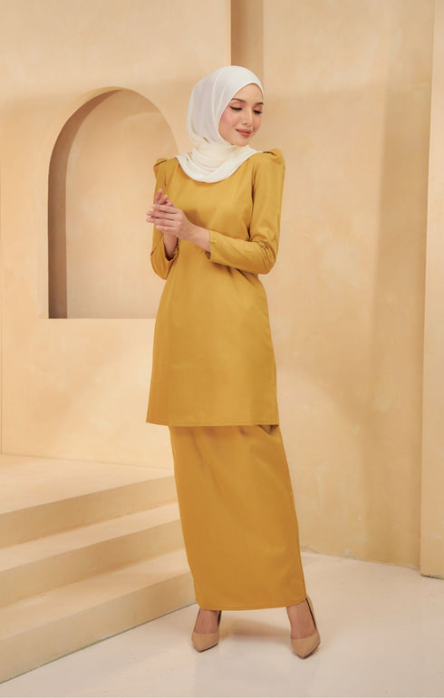 Model styling Kurung Moden Plain Mustard flat lay showing full kurung shape and plain design.