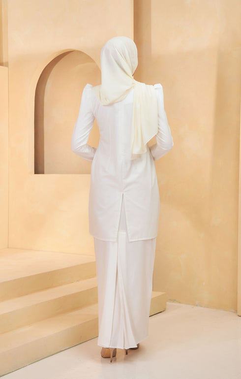 Kuntum Kurung Moden Plain Pearl White side view on model highlighting slim‑fit silhouette