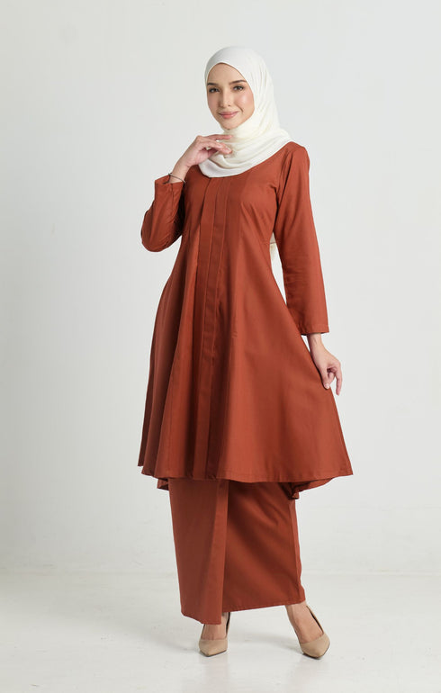 Kebarung Klasik Brick Orange front view on model showing V‑neck and full kebarung design