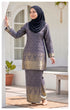 Model wearing a Kurung Moden Navy Blue full outfit with lipat depan kain and lining traditional outfit standing outdoors.